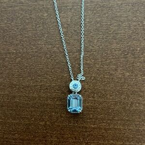 Coach necklace with blue gemstone